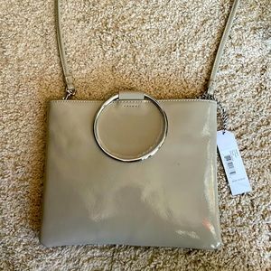 Brand new shoulder bag or remove straps and use the the  loops